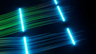 Data represented by luminous lines clustered together by colour. One group is in green, the other is in blue