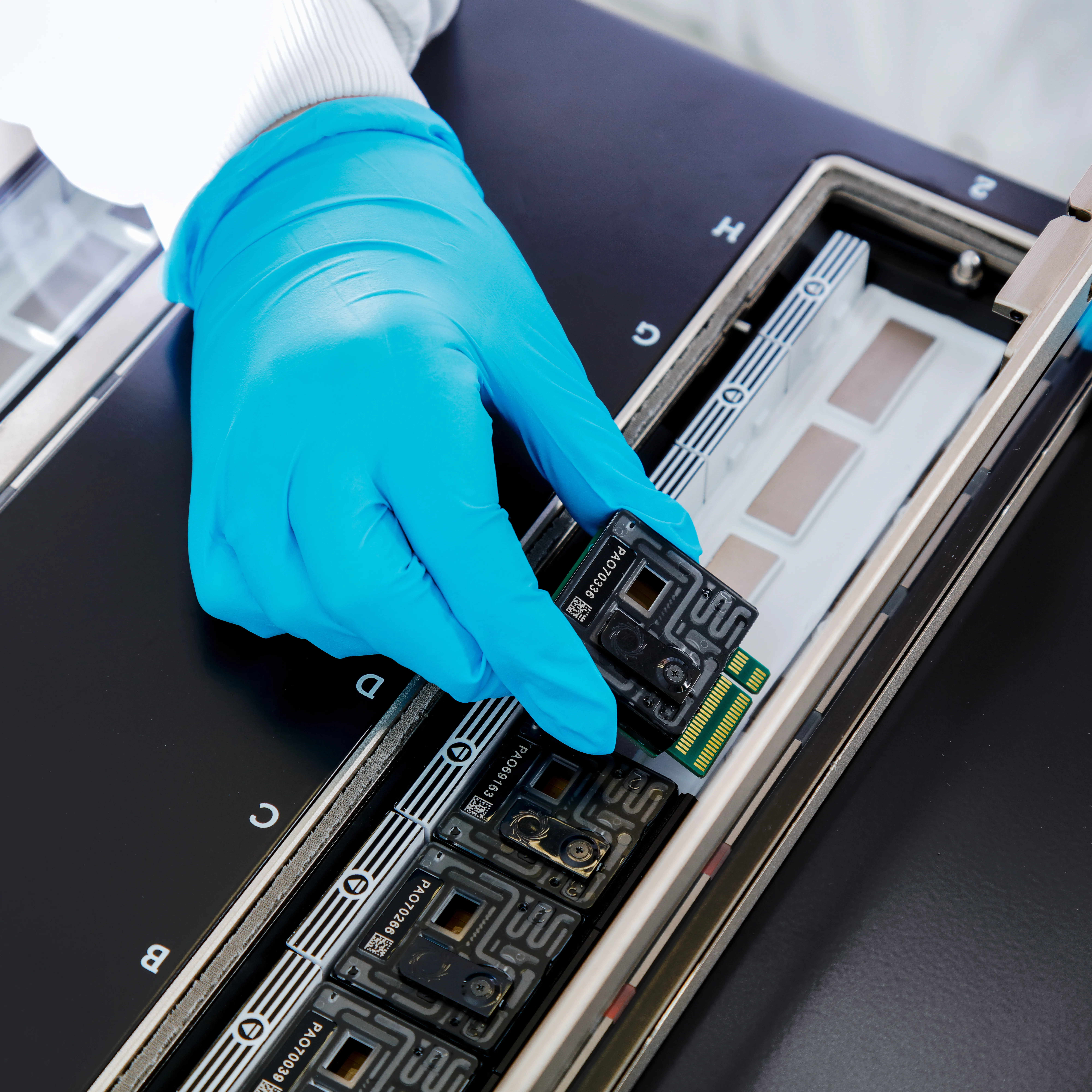PL006c PromethION FC being inserted in a PromethION 24 - Option 2
