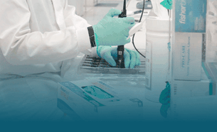 A scientist loading a flow cell